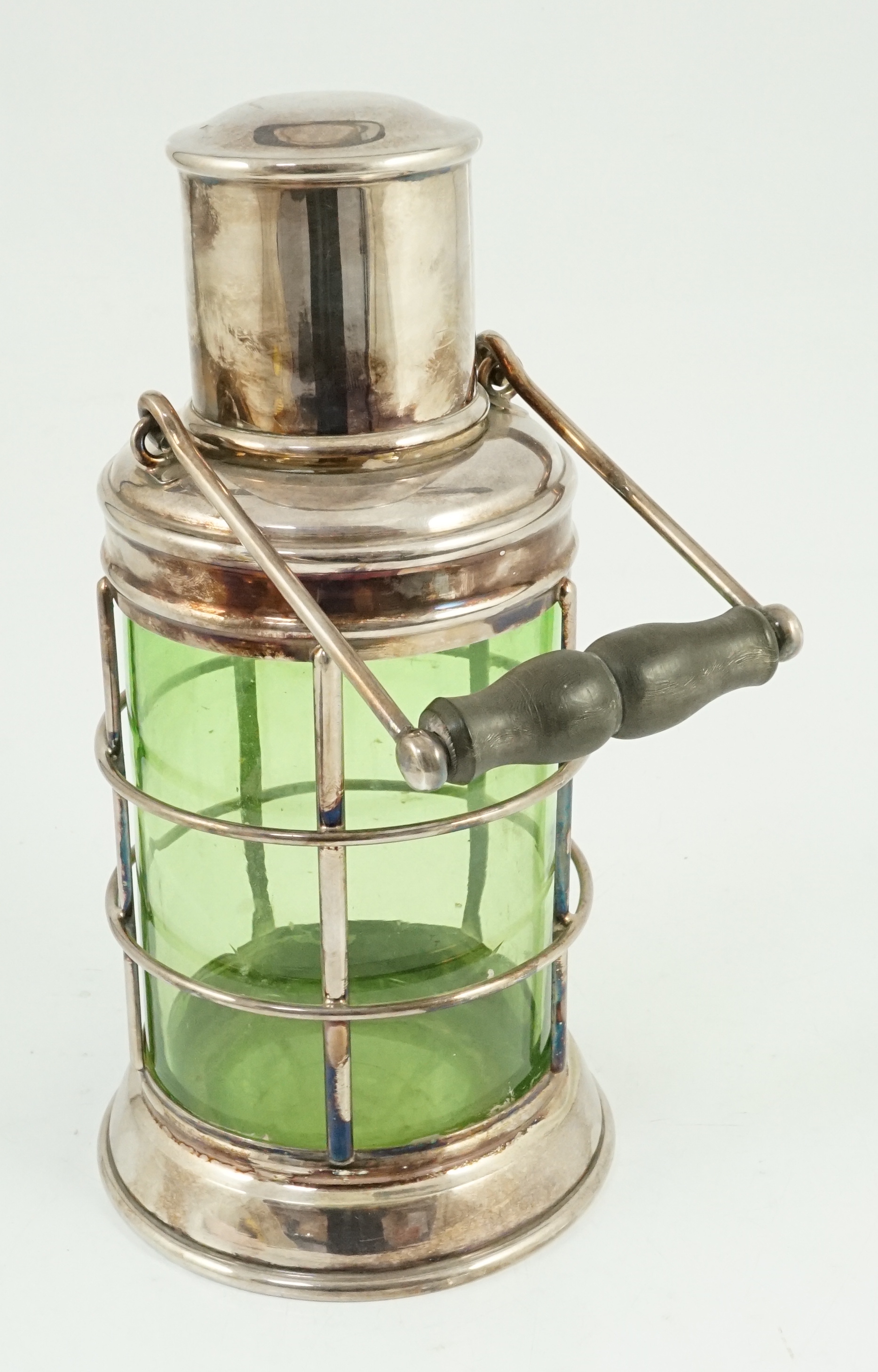 An Asprey & Co. silver plated and green glass novelty cocktail shaker in the form of a lantern